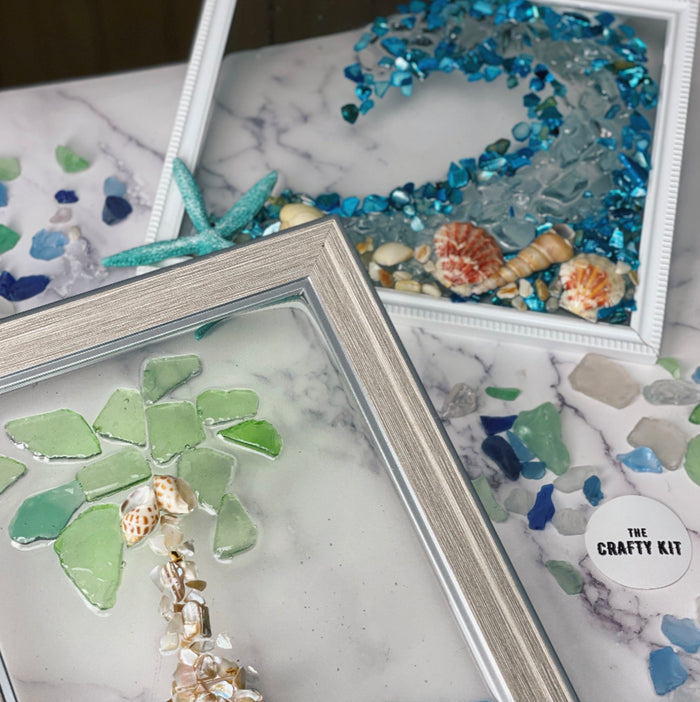 Two frames with blue ocean wave and green palm tree in resin